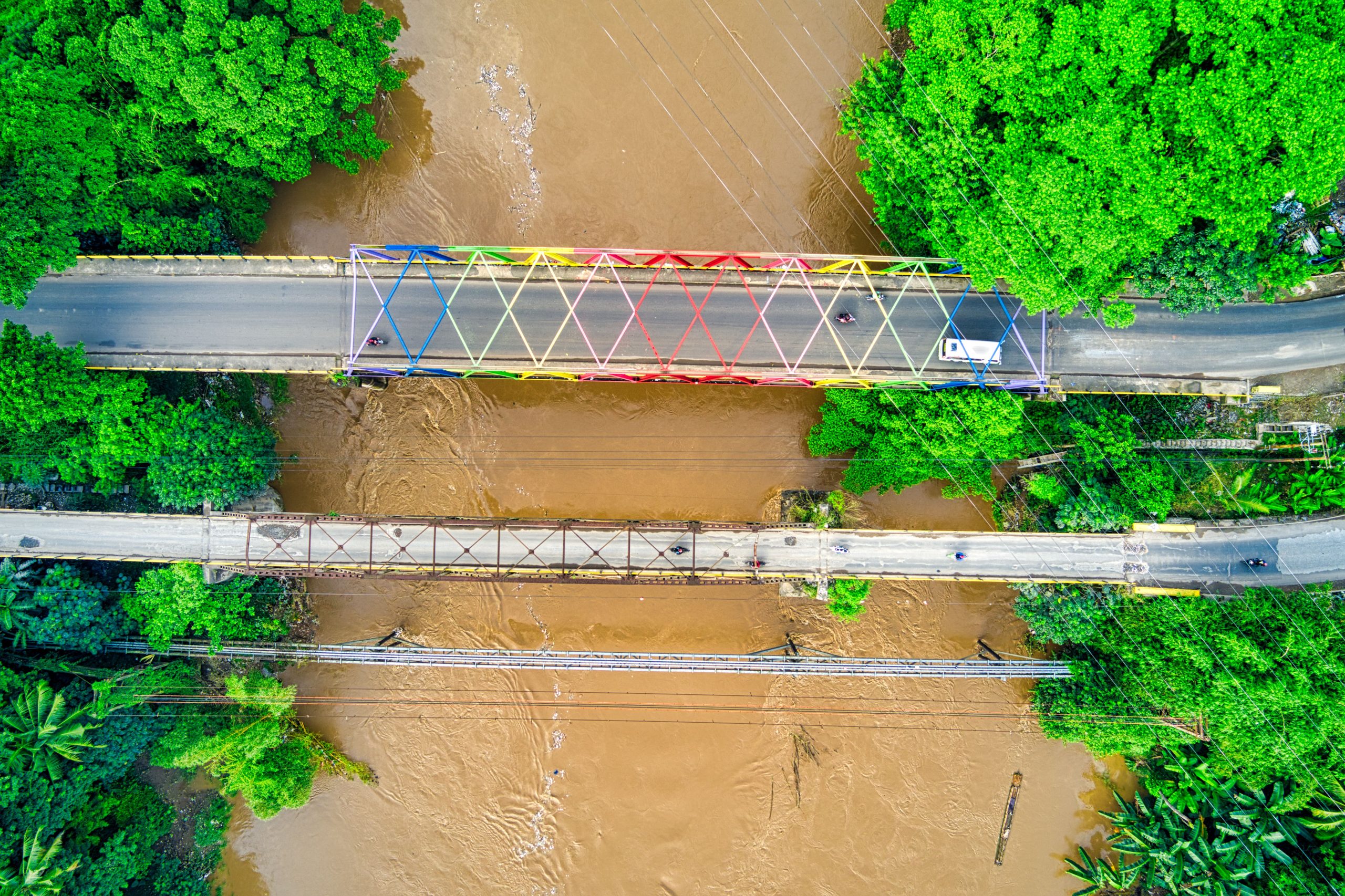 Aerial view of bridge over flooded river showing floodplain extent relevant to HEC-RAS bridge modeling