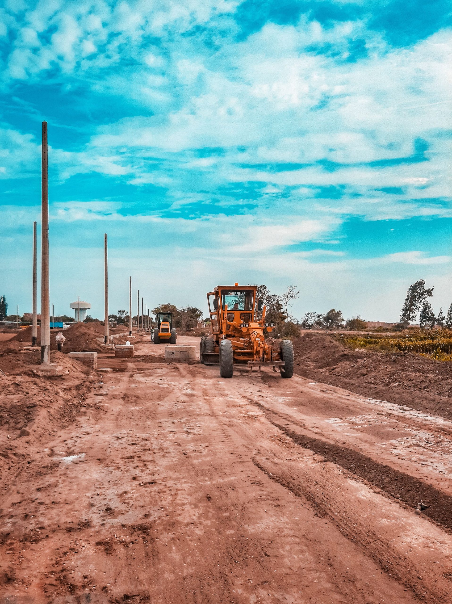 Bulldozer on earthworks construction site - grading and drainage design workflow in AutoCAD Civil 3D 2026