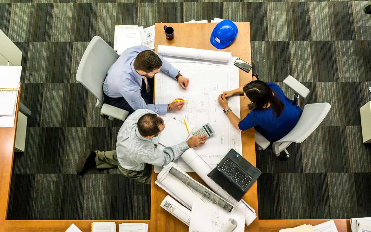 Construction project scheduler reviewing Gantt chart — Primavera P6 vs Microsoft Project 2026 comparison
